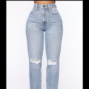 Destroyed knee high waisted/ high rise mom jeans